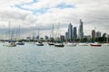 Sailboats Anchored in Front of a City Skyline