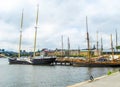 Sailboats and boats in the harbor on the background of the beautiful buildings of Stockholm Royalty Free Stock Photo