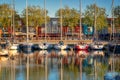 Sailboats and colorful houses of the Gabut district at sunset in the harbor of La Rochelle France