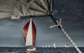 Sailboats compete in a sailing regatta at sunset, sailing race, reflection of sails on water, multi-colored spinaker