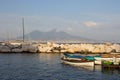 Sailboats in dock against Vesuvius volcano and Mediterranean sea. Boats in harbour in Naples Napoli, Italy. Royalty Free Stock Photo