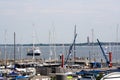 Sailboats docked at the pier with tug boat in background at University of Kiel Sailing Center Royalty Free Stock Photo