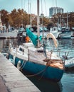 Sailboats docked on a tranquil shore with a beautiful blue sky in the background in Toulon Royalty Free Stock Photo