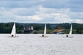 Sailboats floating on the water under a storm cloud Competition sport of sailing Stormy weather Summer travel.