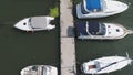 Sailboats moored in the port, a lot of beautiful yachts. Top view on Yachts and boats moored in the port Royalty Free Stock Photo