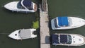 Sailboats moored in the port, a lot of beautiful yachts. Top view on Yachts and boats moored in the port Royalty Free Stock Photo