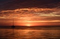 Sailboats on the ocean at sunset. Boat with sails. Sea yacht sailing along water. Royalty Free Stock Photo