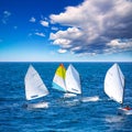 Sailboats Optimist learning to sail in Mediterranean at Denia Royalty Free Stock Photo