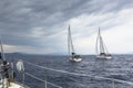 Sailboats participate in sailing regatta 12th Ellada Autumn 2014 among Greek island group in the Aegean Sea Royalty Free Stock Photo