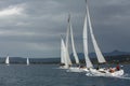 Sailboats participate in sailing regatta 12th Ellada Autumn 2014 among Greek island group in the Aegean Sea Royalty Free Stock Photo