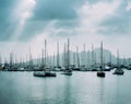 Sailboats and pleasure boats in the porto grande bay of the historic city Mindelo. Clodscape with Sunrays Royalty Free Stock Photo