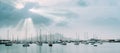 Sailboats and pleasure boats in the porto grande bay of the historic city Mindelo. Sunrays Royalty Free Stock Photo