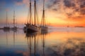 sailboats reflection on calm water at dawn