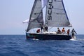 Sailboats sail in windy weather in the blue waters of the Aegean Sea