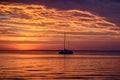 Sailboats at sunset. Ocean yacht sailing along water. Summer traveling. Royalty Free Stock Photo