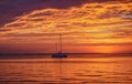 Sailboats at sunset. Ocean yacht sailing along water. Summer traveling. Royalty Free Stock Photo