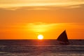 Sailboats at sunset on a tropical sea. Silhouette photo.