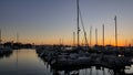 Sailboats Tethered at the Marina Dock at Sunset in San Diego California