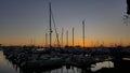 Sailboats Tethered at the Marina Dock at Sunset in San Diego California