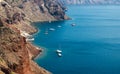 Sailboats and yachts near volcanic rocks of Santorini island, Greece