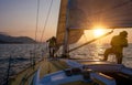 Sailing along the coastline of an island during a beautiful sunset. Royalty Free Stock Photo