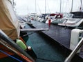 Yachts at the pier in the rain.