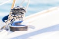 Sailing background, nautical rope tied on winch of sailboat deck Royalty Free Stock Photo