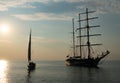 Sailing boat achored on Tallinn bay. 3 mast sailing yacht enjoying the sunset on calm Baltic sea. Beautiful weather and Royalty Free Stock Photo