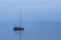 Sailing boat alone in the ocean durig blue hour Royalty Free Stock Photo