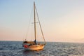 Sailing boat anchored in the middle of the sea at sunset Royalty Free Stock Photo