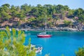 Sailing boat in the bay of the beautiful Aliki beach, Thassos island, Greece Royalty Free Stock Photo