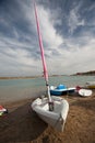 Sailing boat on a beach with stormy sky Royalty Free Stock Photo