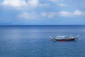 Sailing boat in the blue ocean of Anilao