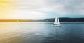 Sailing boat on a calm lake with reflection in the water. Beautiful landscape, Lake Uberlingen, Germany Royalty Free Stock Photo