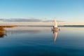 Sailing boat on a calm lake with reflection Royalty Free Stock Photo