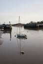 A sailing boat on Colne River at Wivenhoe, Essex in the UK Royalty Free Stock Photo