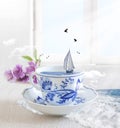 Sailing Boat in a cup of tea with birds