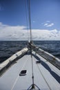 Sailing boat deck sailing on a North sea in cloudy day. Royalty Free Stock Photo