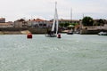 Sailing boat entering the habour Royalty Free Stock Photo