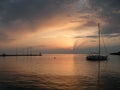 Sailing boat floating on a peaceful surface of theAdriatic Sea,Croatia,Europe.Sunset and the calm sea with beautiful purple sky an