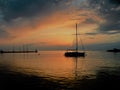 Sailing boat floating on a peaceful surface of theAdriatic Sea,Croatia,Europe.Sunset and the calm sea with beautiful purple sky an