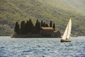 Sailing boat and Gospa od Skrpjela Royalty Free Stock Photo