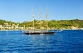 Sailing boat in ront of the sea shore and blue sky