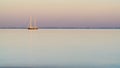 Sailing boat, isle of Re, at sunset on a very calm sea Royalty Free Stock Photo