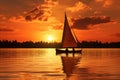 Sailing boat on the lake at sunset. Beautiful summer landscape, A couple sailing on a peaceful lake as the sun sets Royalty Free Stock Photo