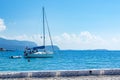 Sailing boat leaving the harbour of Samos city Royalty Free Stock Photo