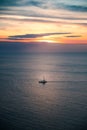 Sailing boat and line of horizon at sunset Royalty Free Stock Photo