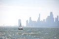 Sailing boat on Montrose beach with Chicago city in the background Royalty Free Stock Photo