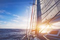 Sailing boat in open sea at sunset, beautiful luxurious yacht Royalty Free Stock Photo