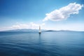 sailing boat, with person at the helm, sailing on azure sea Royalty Free Stock Photo